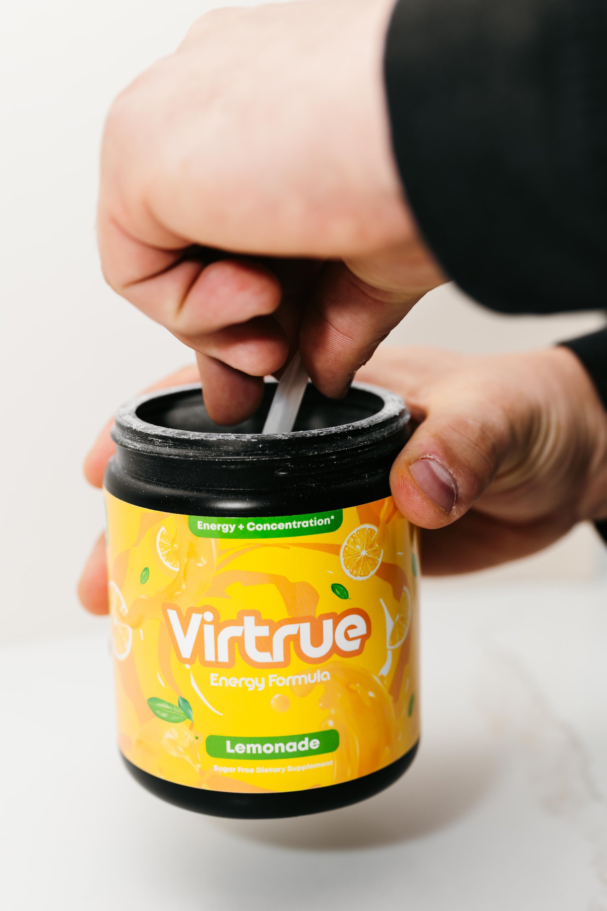 Virtrue Lemonade Pre Workout Tub Being Scooped