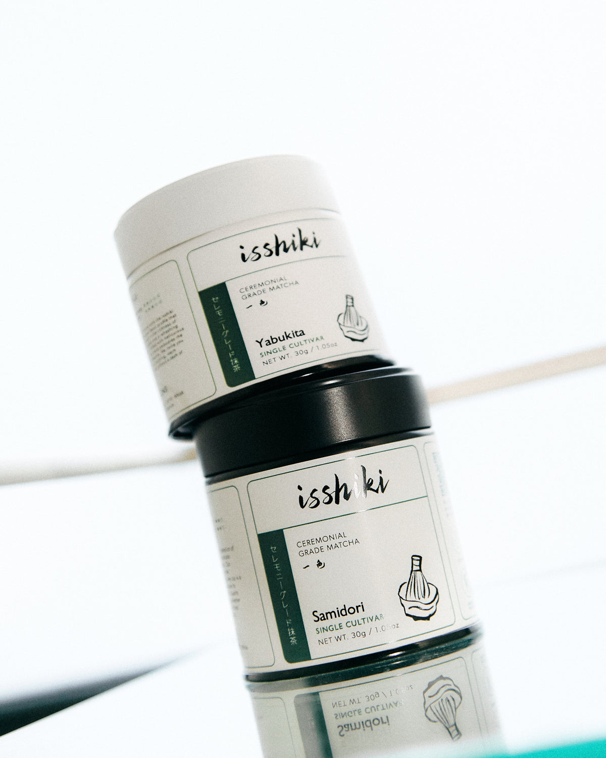 Isshiki Samidori ceremonial matcha tins stacked in a minimalist product display