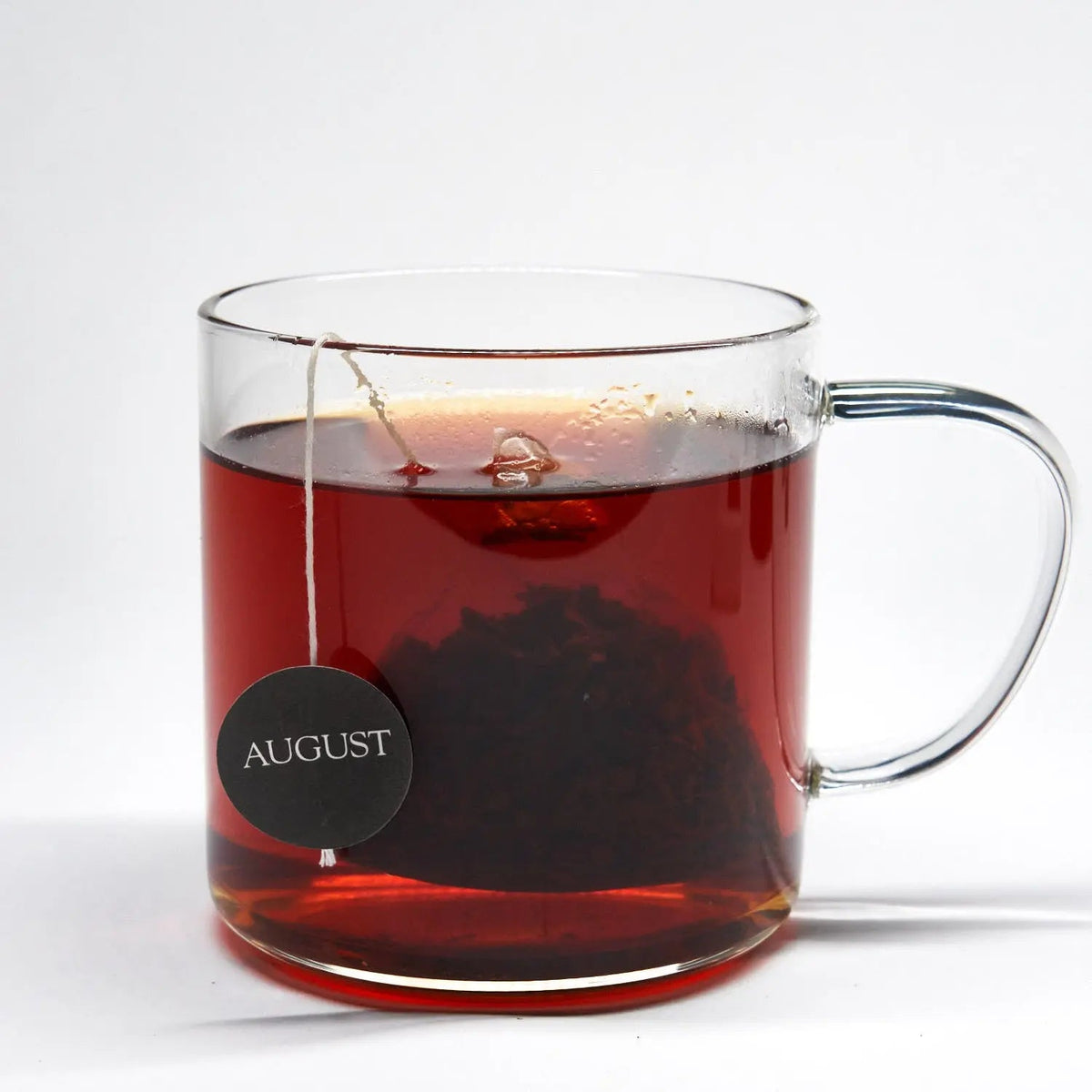 Glass cup filled with brewed August Low Country Bourbon Sugar Black Tea