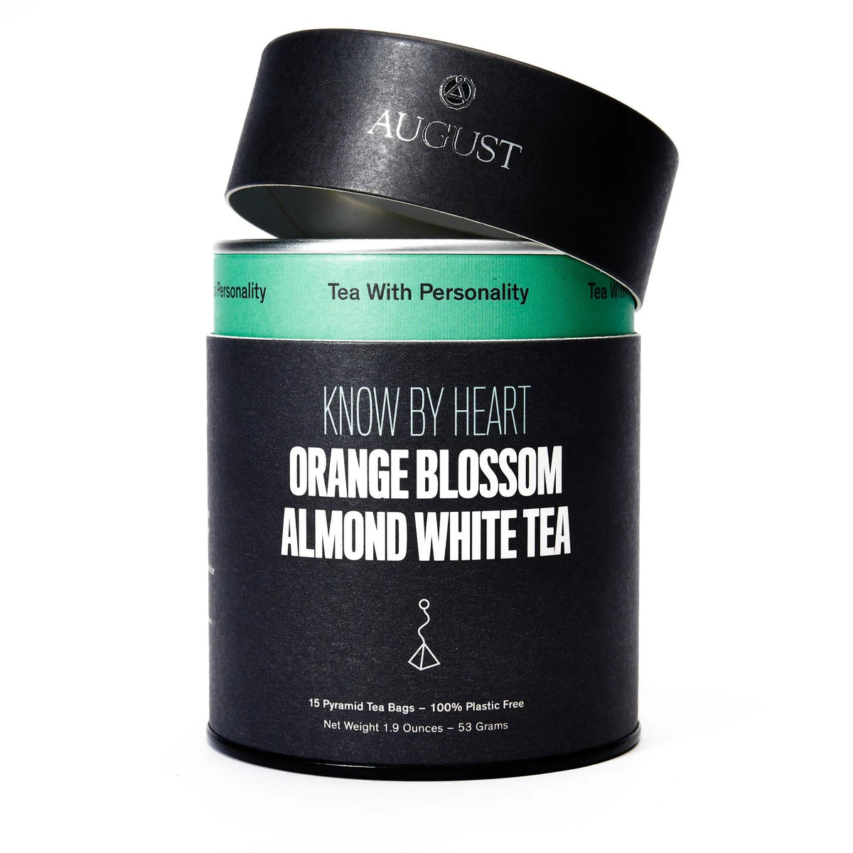 Open August Know by Heart White Tea tin displaying a pyramid tea bag inside the container