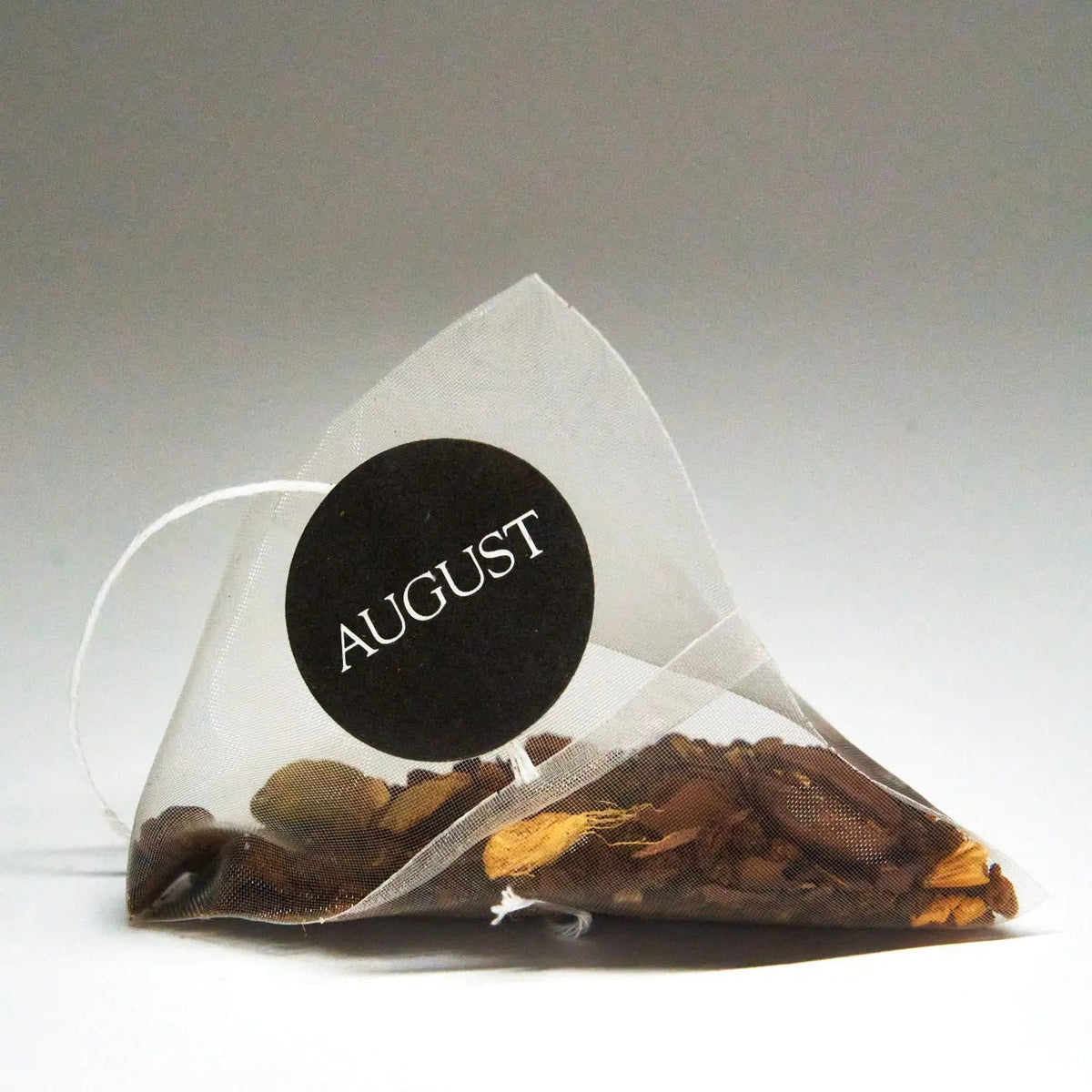 August Dirty Chai pyramid tea bag filled with black tea, coffee and aromatic spices