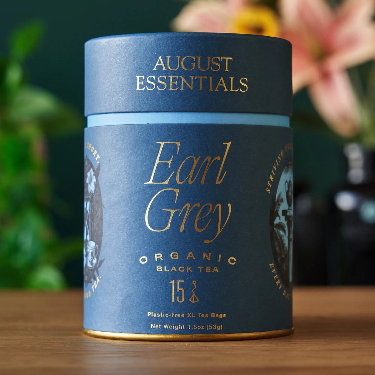 August Essentials Organic Earl Grey Black Tea in blue cylindrical packaging containing 15 tea bags