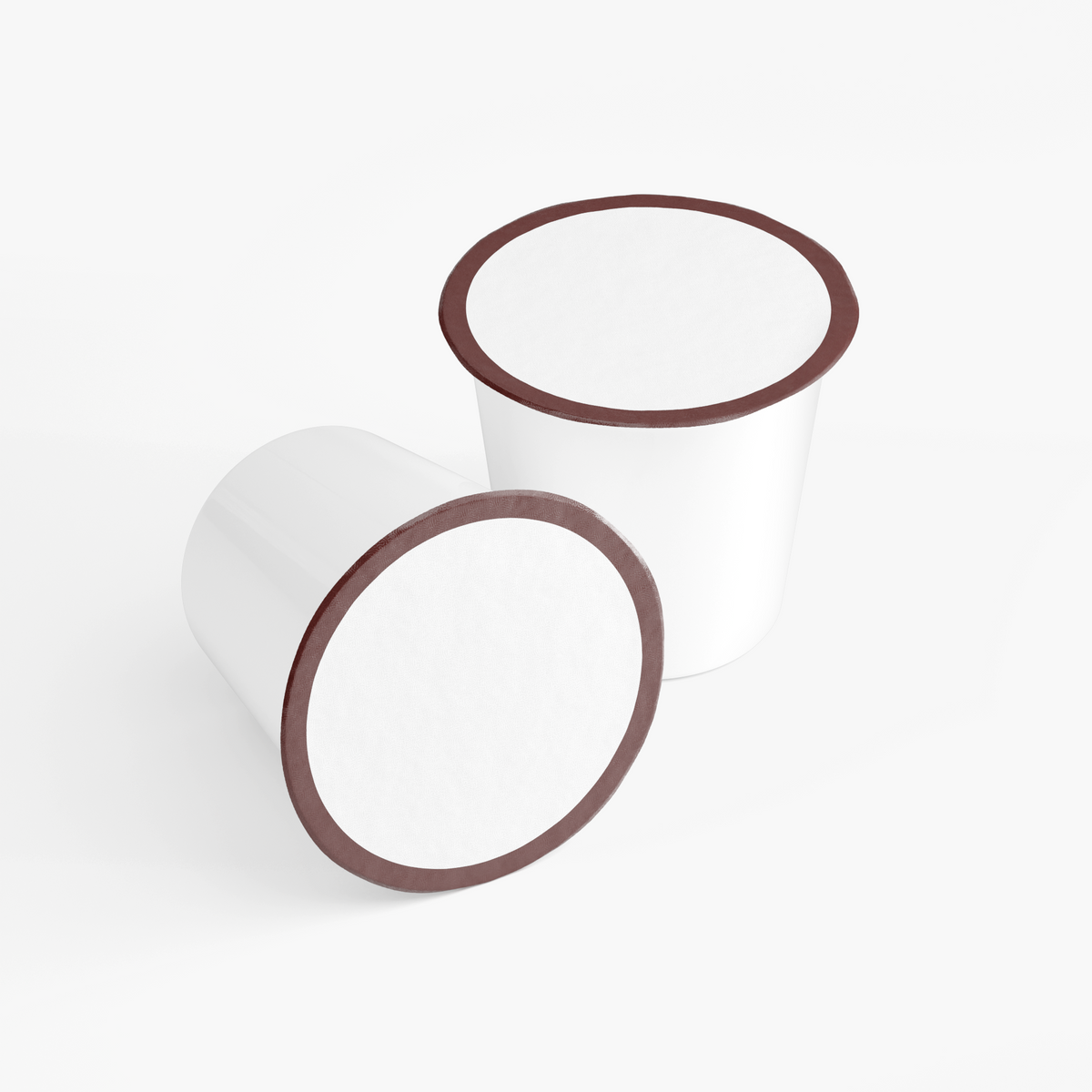 Two white single-serve coffee pods with dark brown rims for Virtrue Molten Caramel dark roast coffee