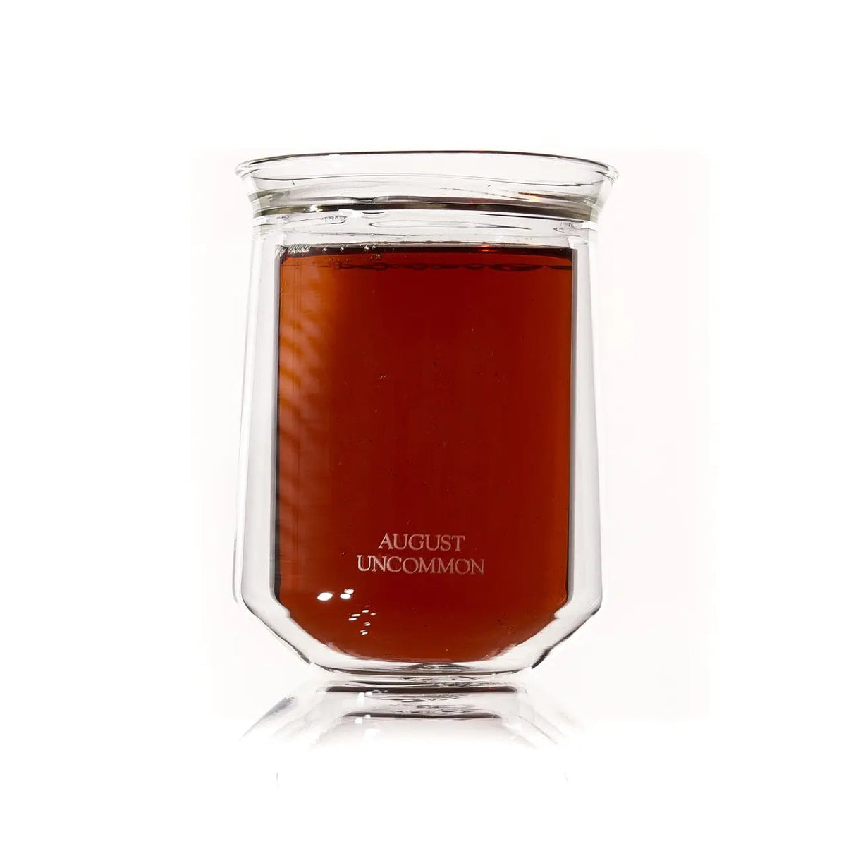 August Uncommon Tea double-walled glass tasting cup filled with brewed tea