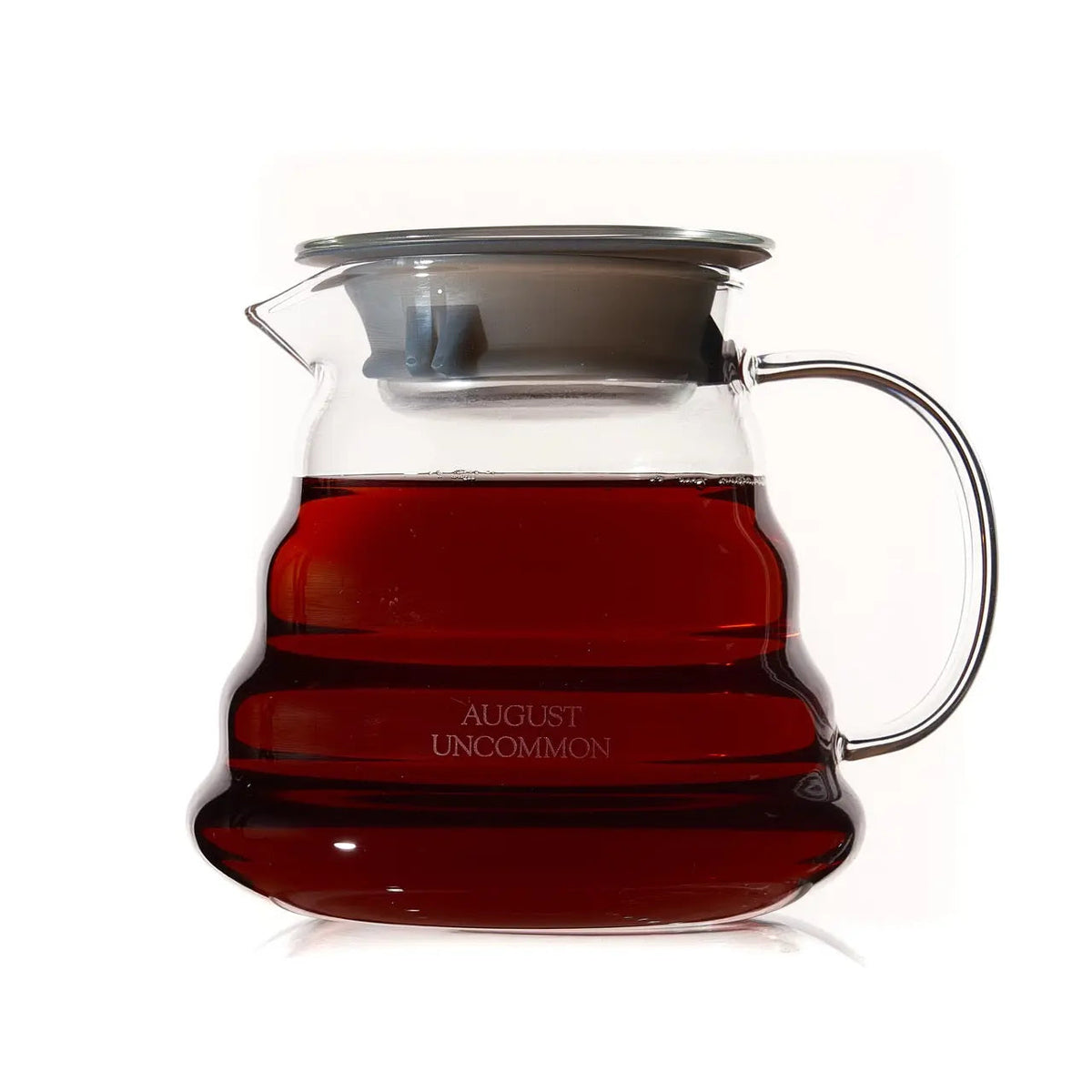August 20 oz clear glass teapot filled with brewed loose leaf tea