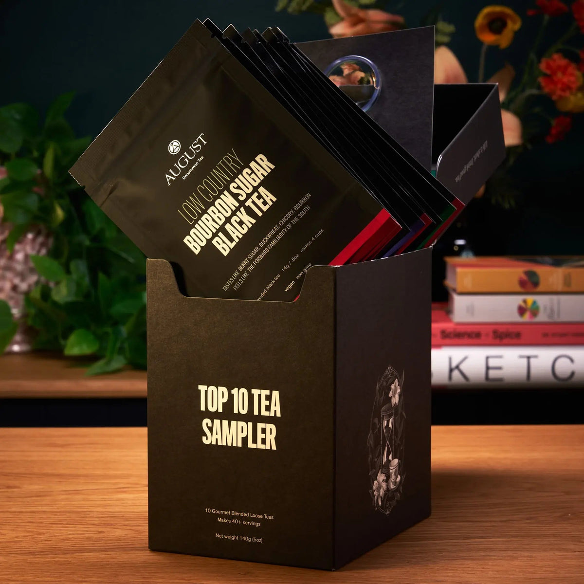 Open August Uncommon Tea Top 10 sampler box displaying individually packaged loose leaf tea blends