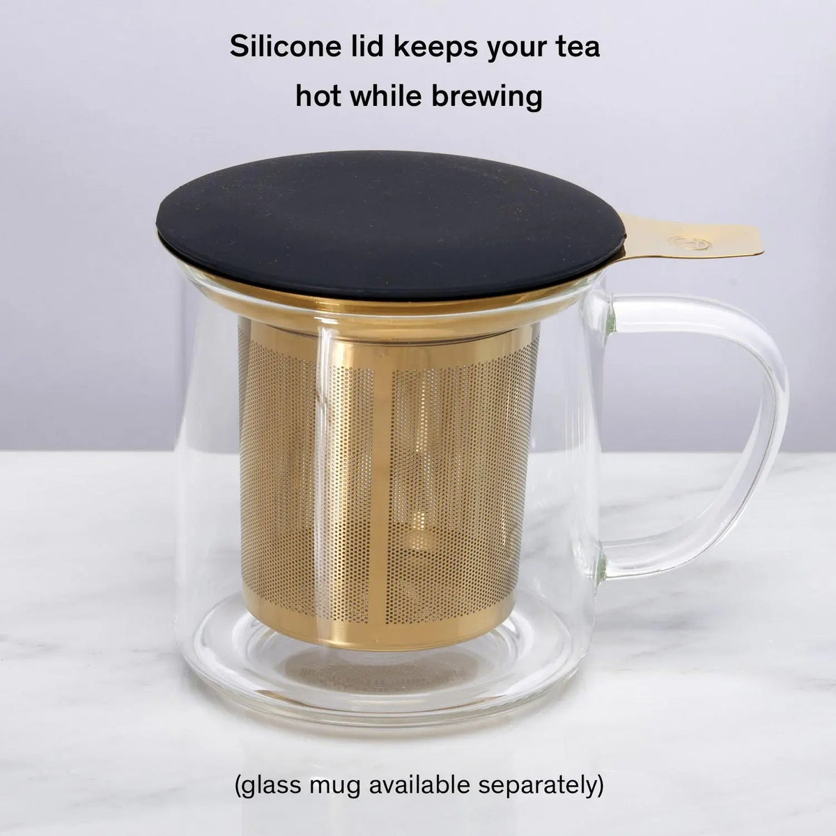 Gold stainless steel tea infuser in glass mug with silicone lid
