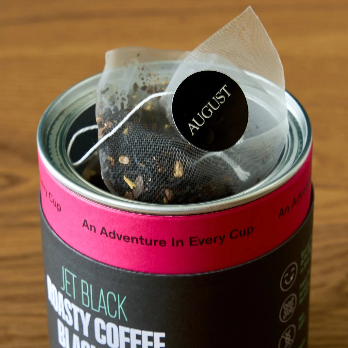 Open August Jet Black tea tin showing individually portioned pyramid tea bags
