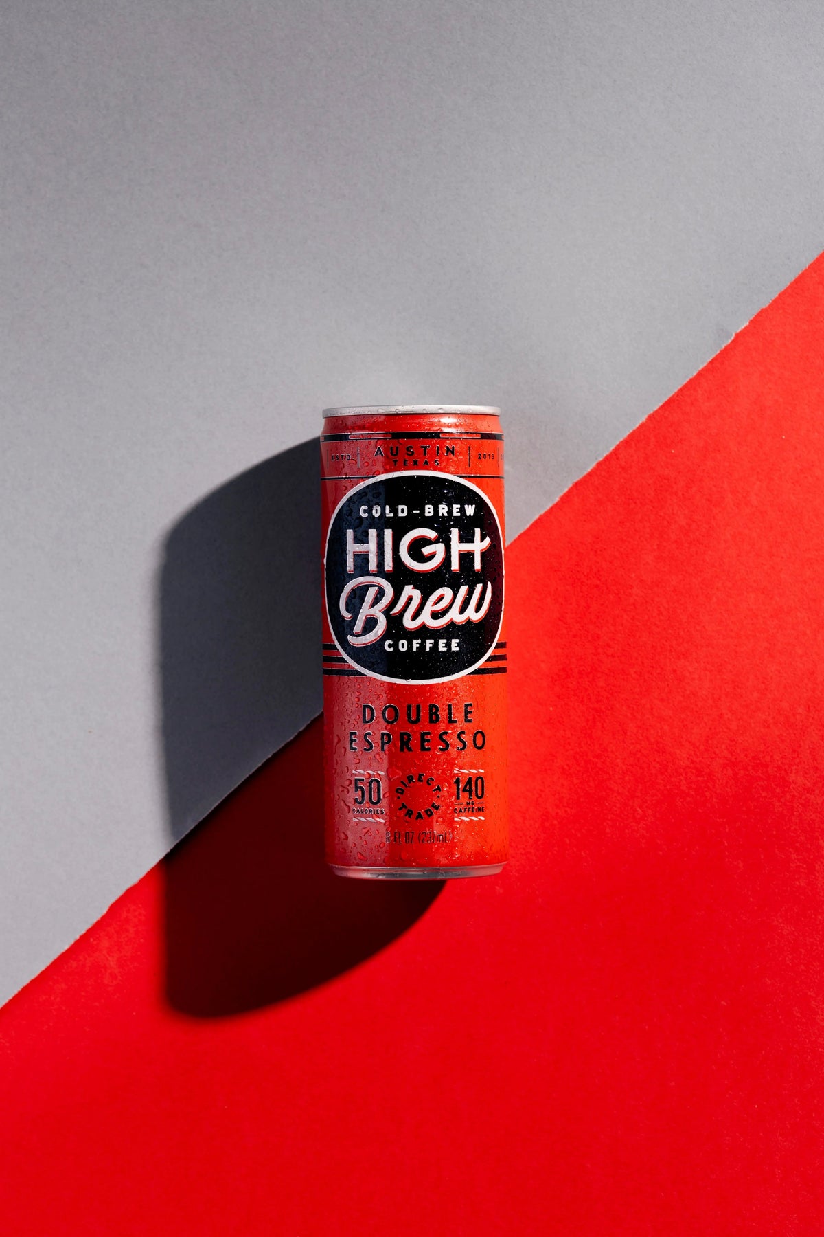 High Brew Double Espresso red canned cold brew coffee against a red and gray background