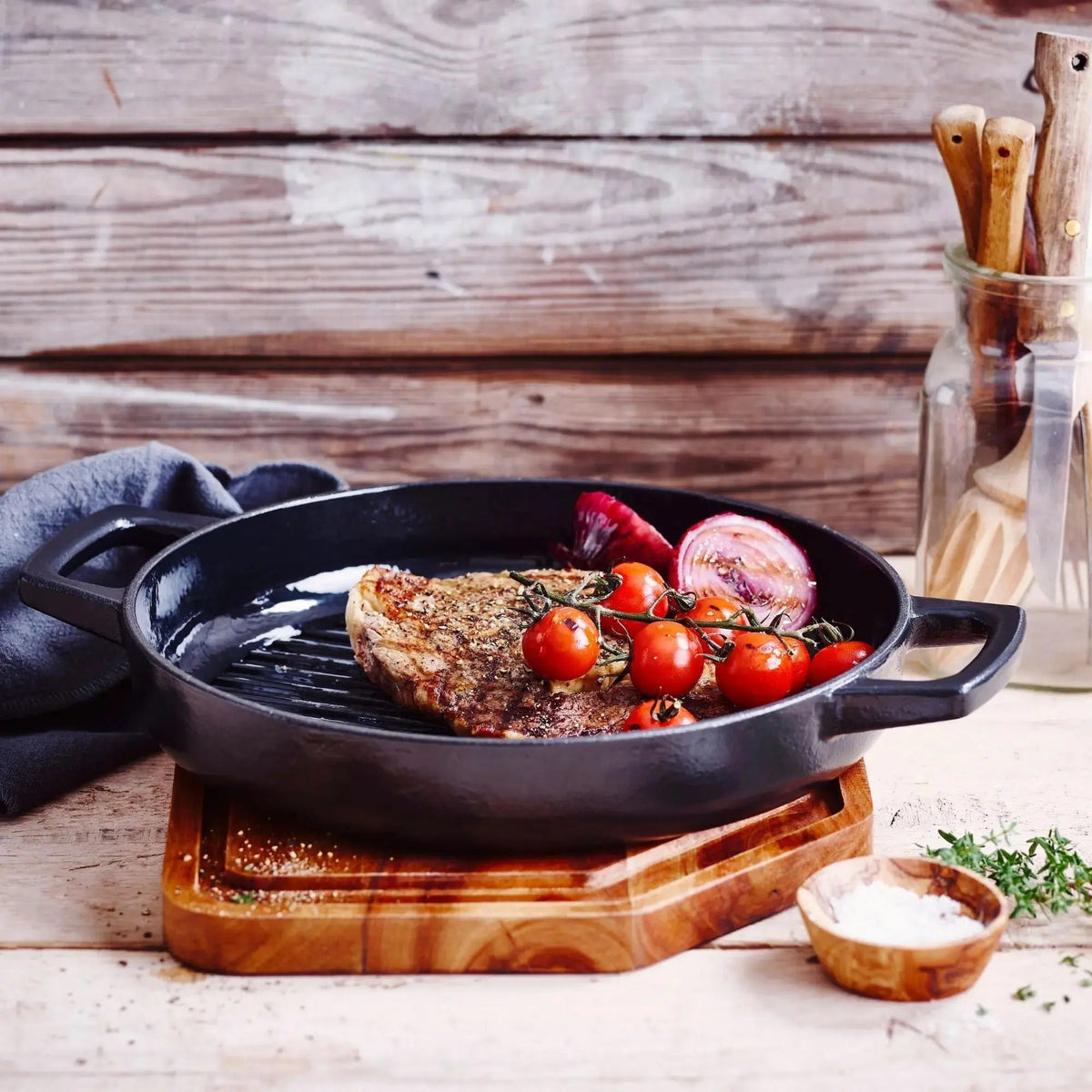 Alva enameled cast iron grill pan with grilled vegetables on a wooden table