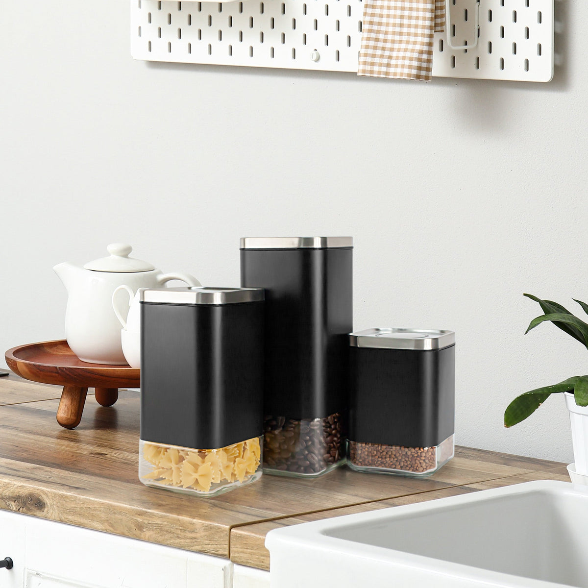 Kaffé airtight glass coffee storage containers displayed on a modern kitchen countertop