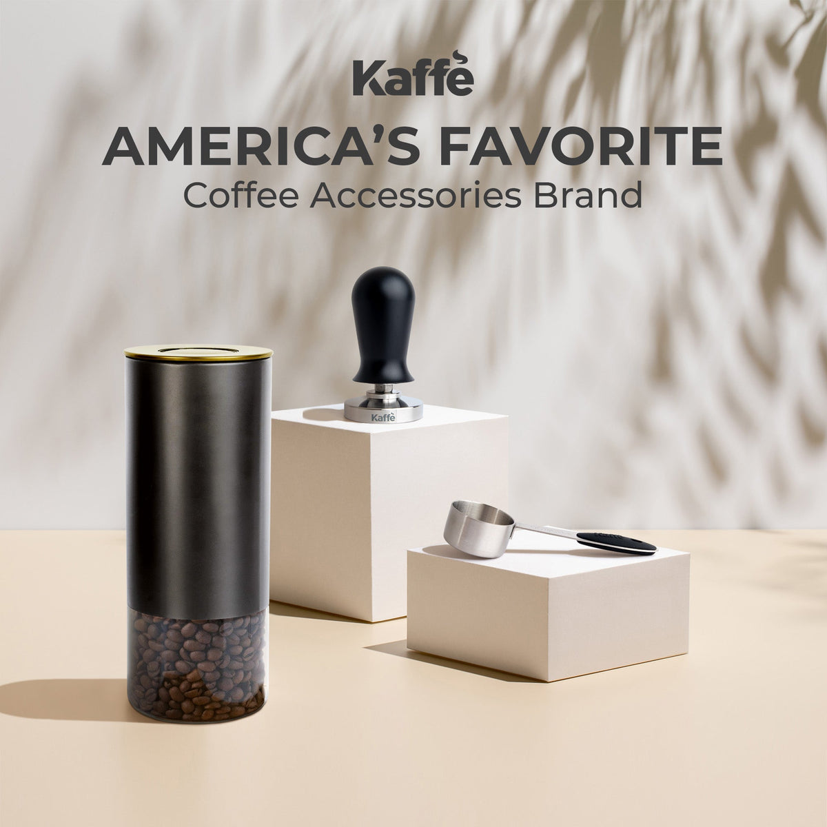 Kaffé round coffee storage canister displayed alongside coffee brewing equipment and accessories