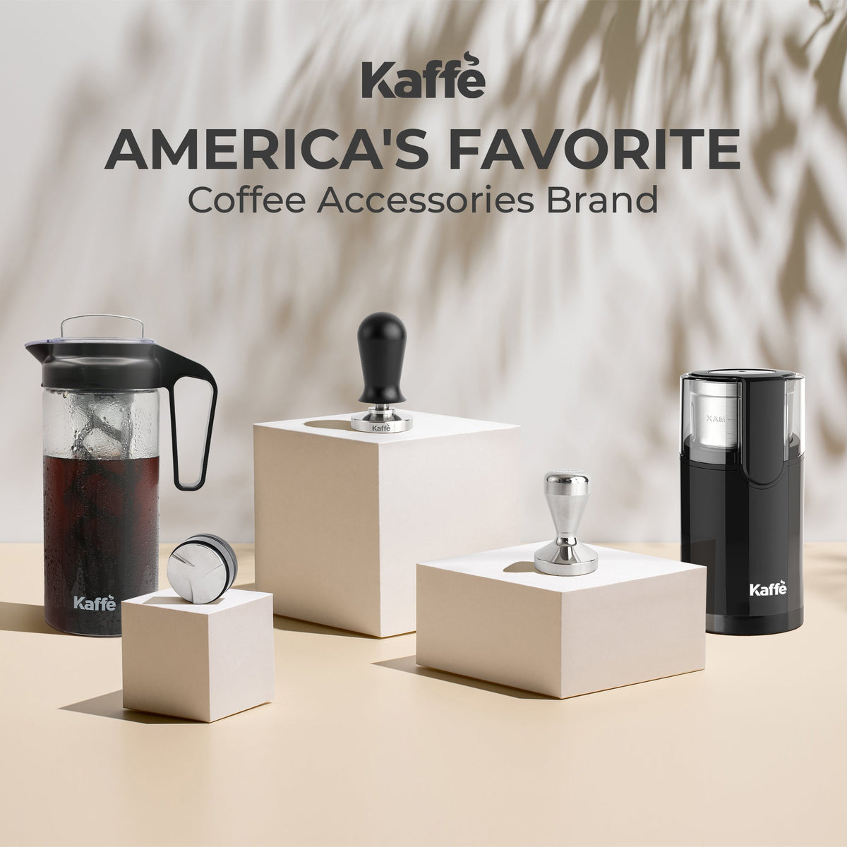 Kaffé stainless steel espresso tamper displayed with premium coffee brewing accessories