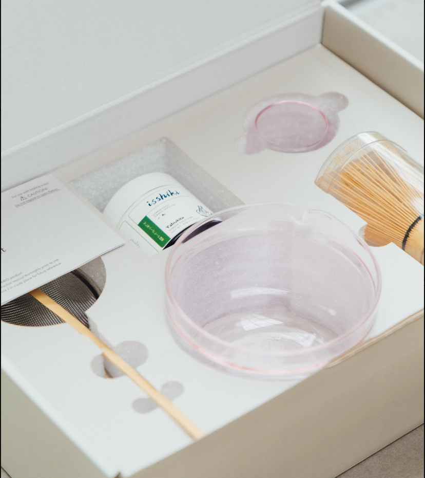 Overhead view of Hario glass matcha bowl and accessories in Isshiki matcha gift set