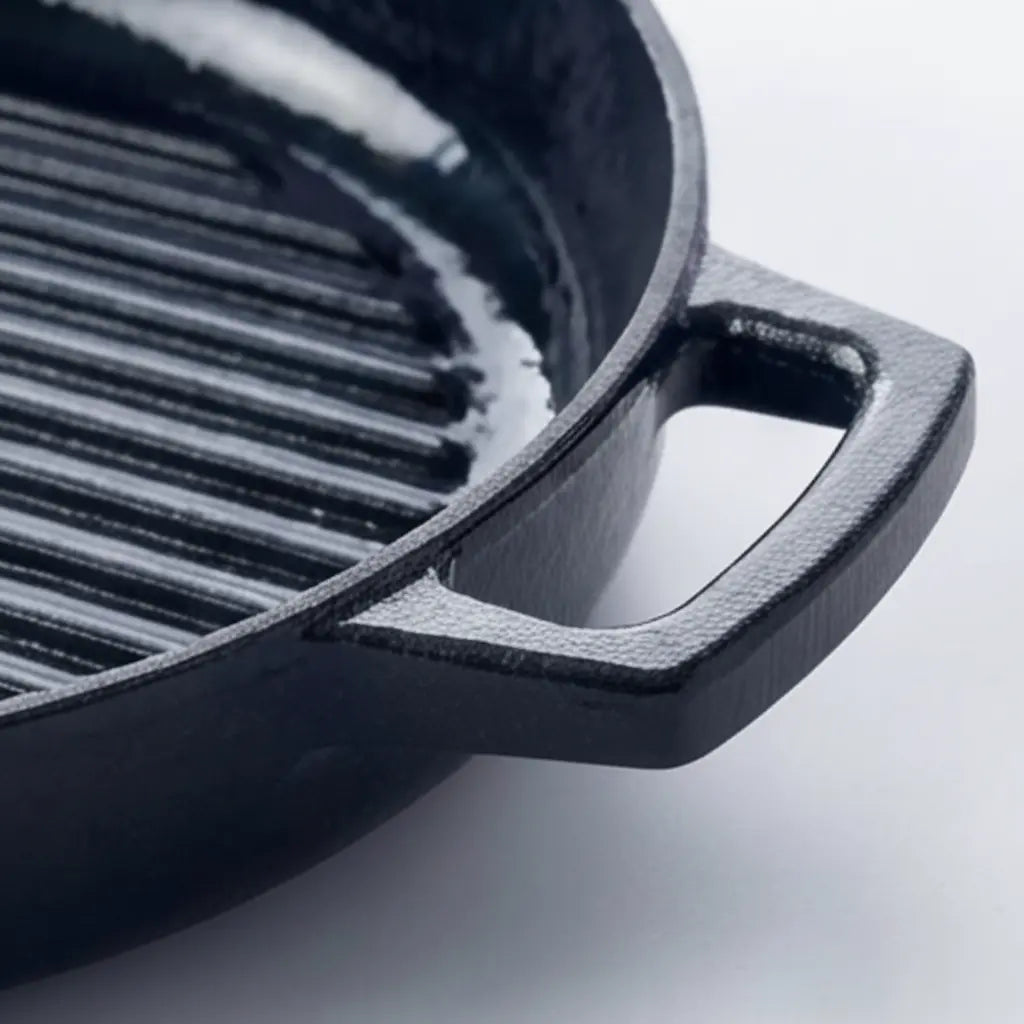 Close-up of the enameled cast iron construction and side handle of an Alva grill pan