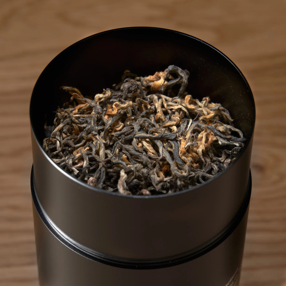 Close-up of organic Nepalese loose leaf black tea inside Rare Leaves Gold tin
