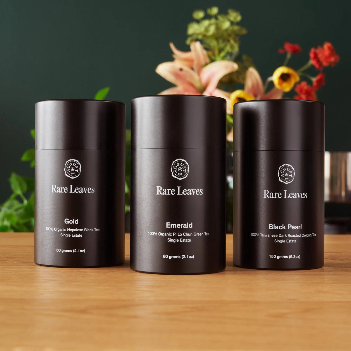 August Rare Leaves luxury loose leaf tea gift set featuring Gold, Emerald and Black Pearl aluminum tea tins