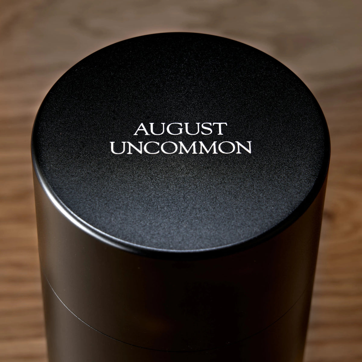 Top view of August Uncommon Tea Rare Leaves Black Pearl aluminum tea caddy lid