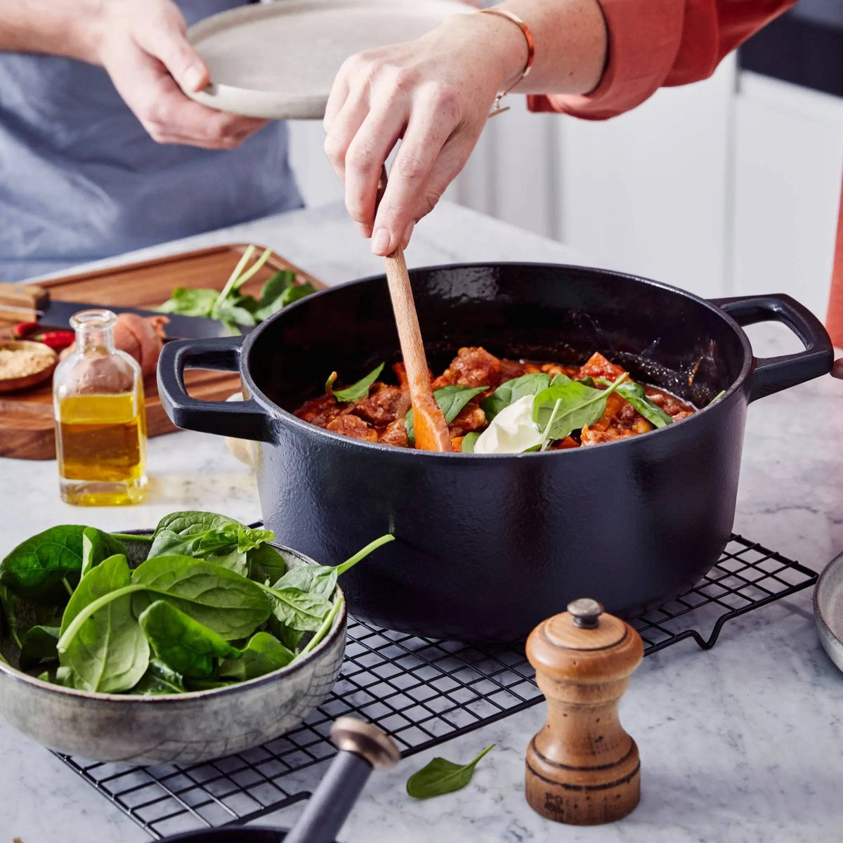 Vegetables and homemade food being prepared in an Alva enameled cast iron Dutch oven