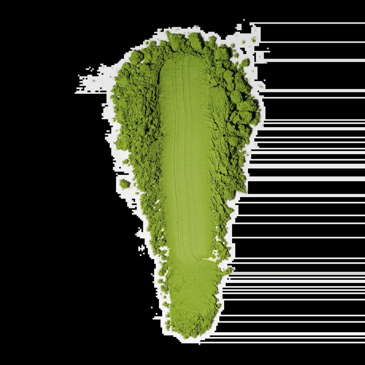 Bright green matcha powder displayed beside a measurement scale on a black background
