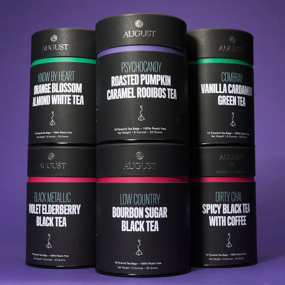 August Uncommon Tea variety gift set featuring six premium tea blends in black tins, with 90 tea bags total