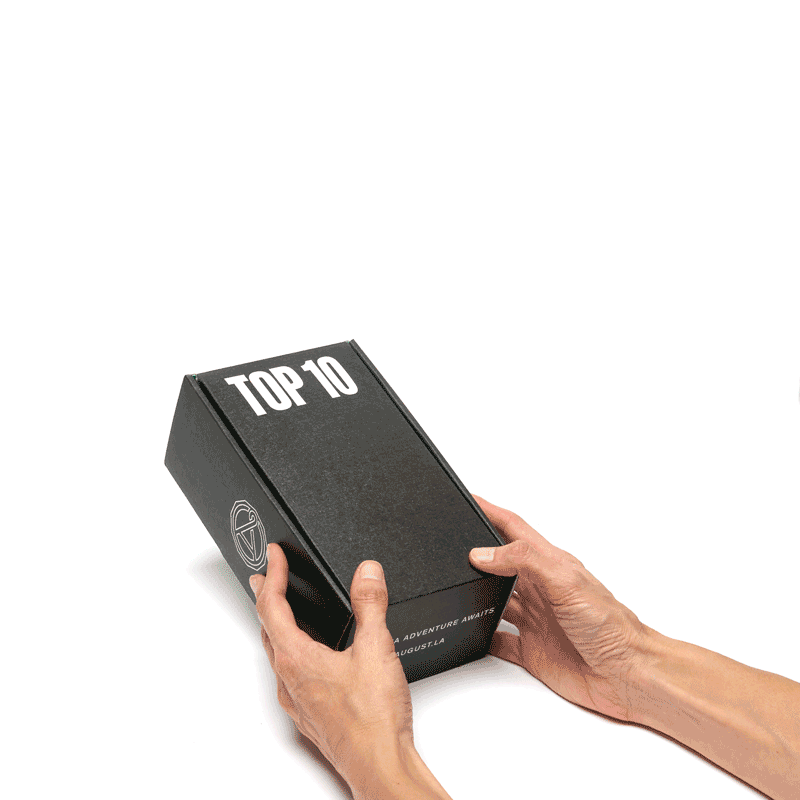 August Top 10 Caffeine-Free Herbal Tea Sampler in black gift box held in two hands